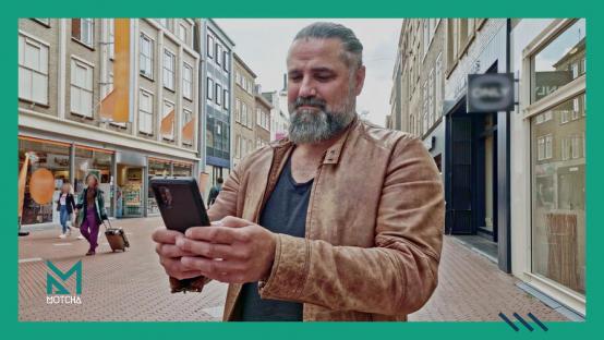happy man watching video on smartphone